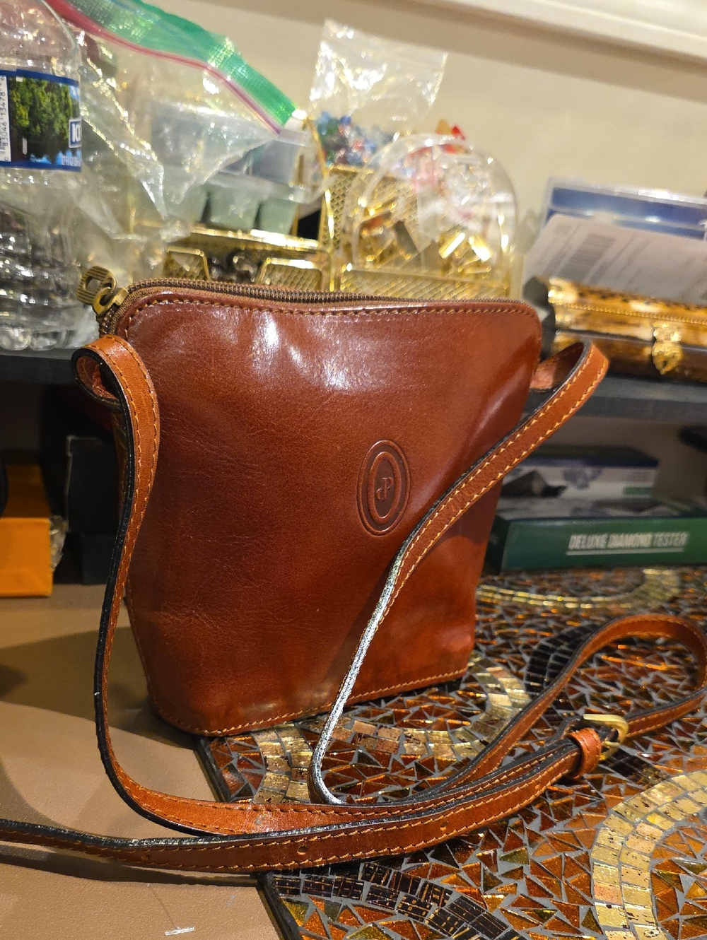 Compact Brown Leather Crossbody Bag with Subtle Logo